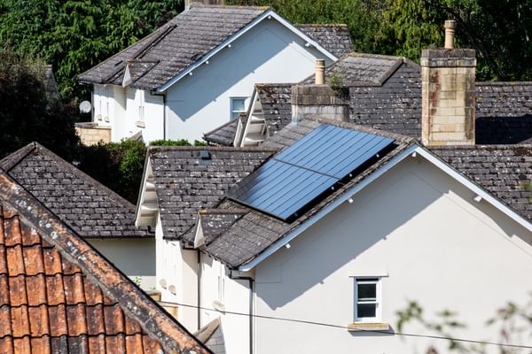 photograph of solar panels on house roofs