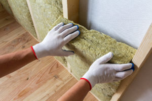 Photo of person installing insulation