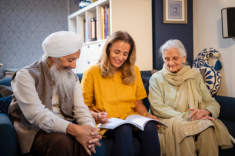 Elderly couple speaking to an energy advisor